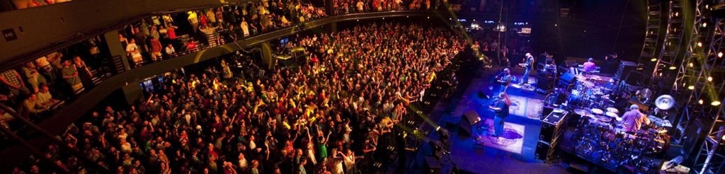 Wide shot of the stage and audience at a performance at ACL Live at the Moody Theater